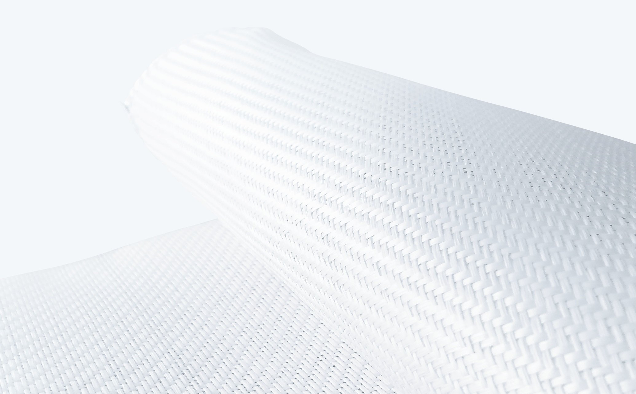 白色の細かい格子模様が織り込まれた平らで柔らかそうな布地の拡大部分