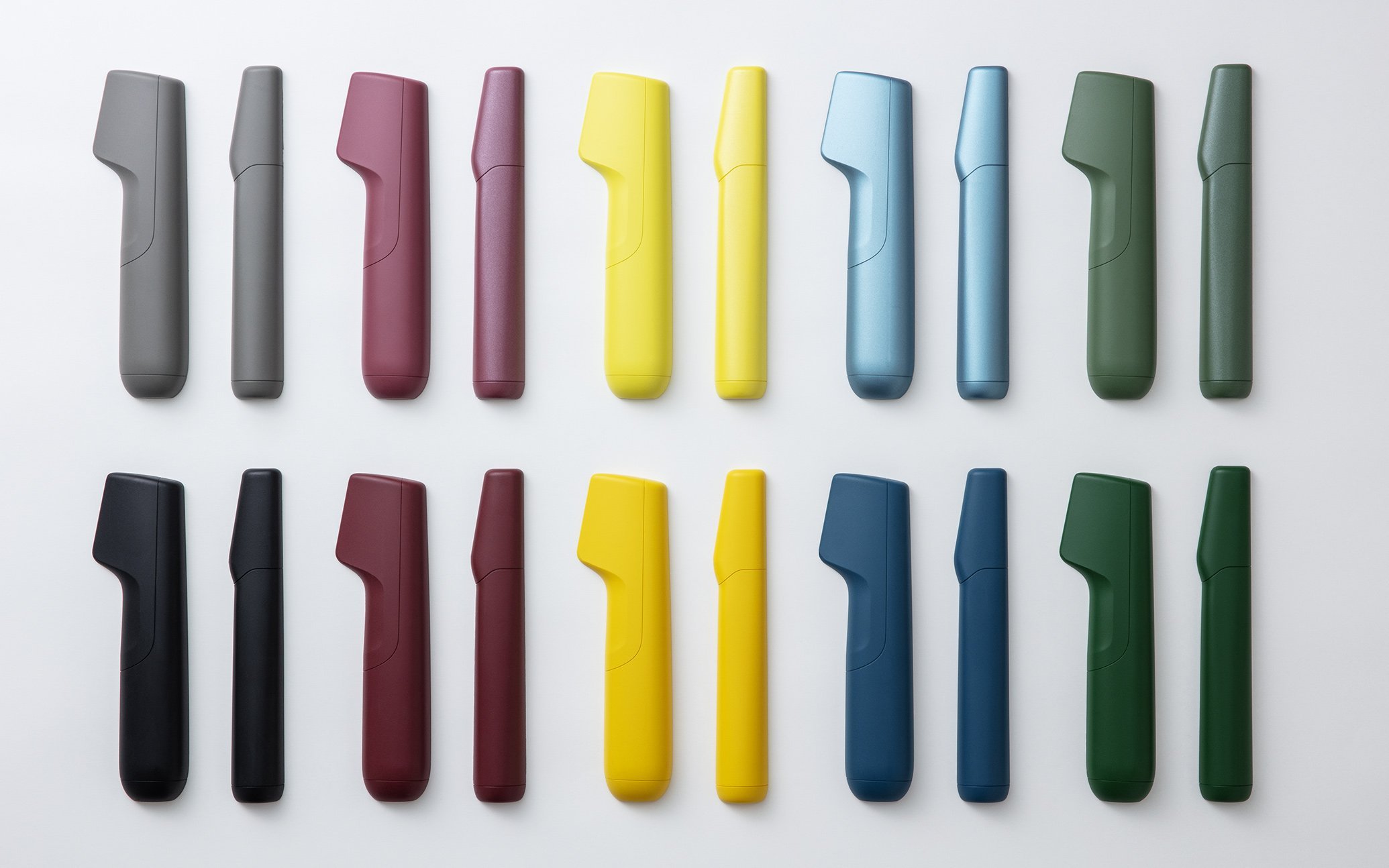 色と形が異なる電動トリマーの並ぶ写真、グレー、ピンク、イエロー、ブルー、グリーンの順 