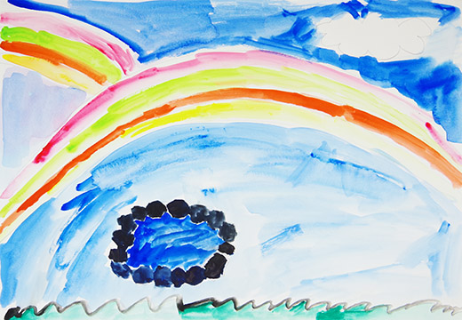 池のある野原の上にうかぶにじ