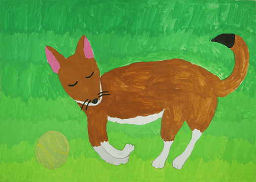 草原にねている犬