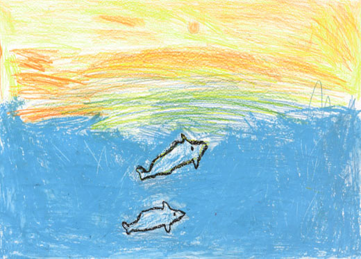 夕日がかかっている海でおよぐイルカ