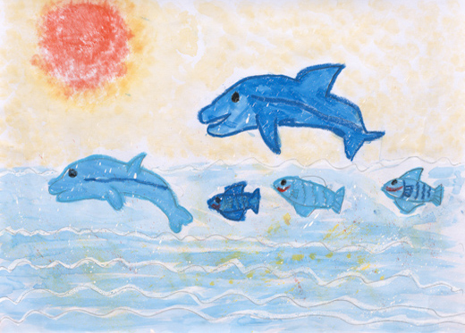 夕日に向かってイルカがとぶ